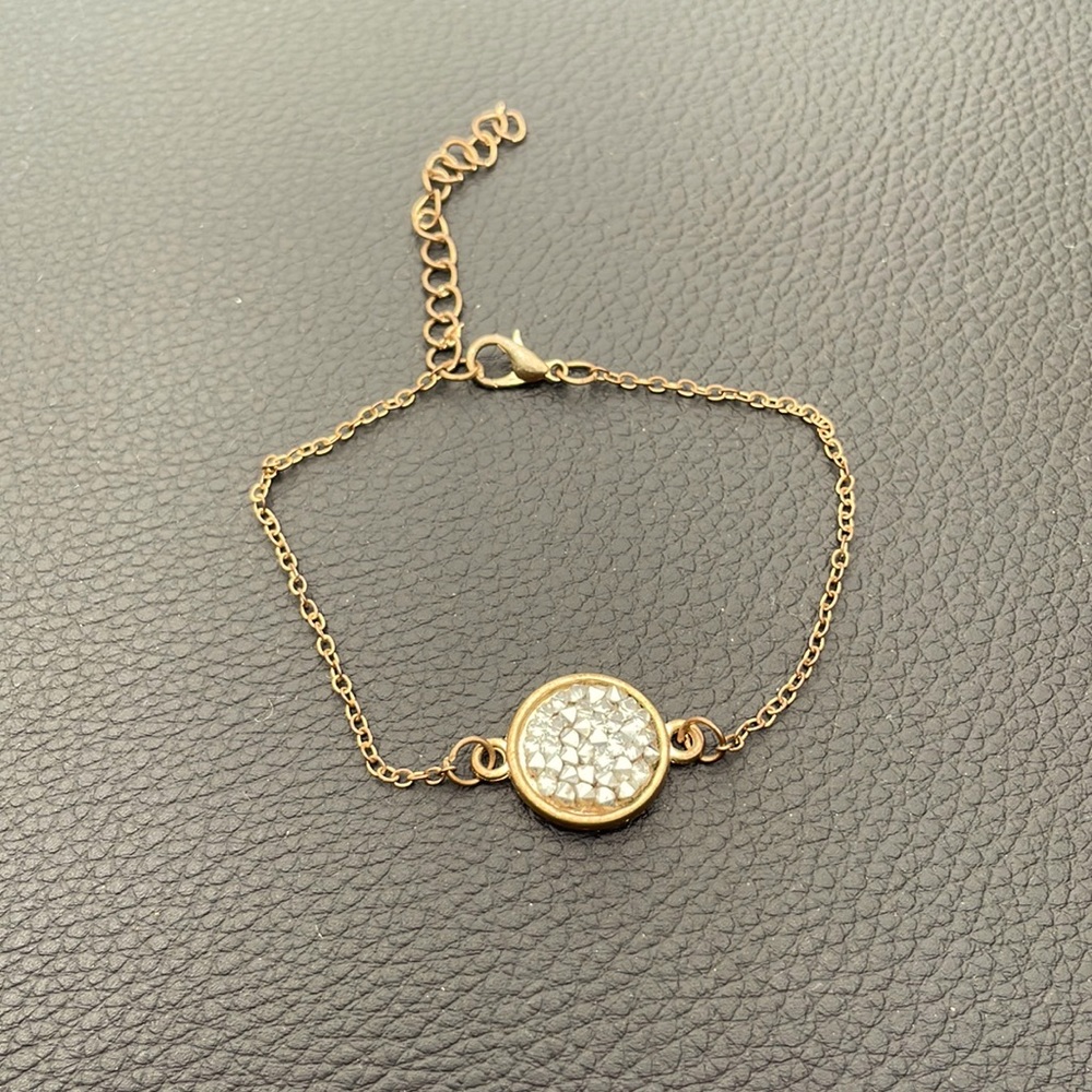 Copper colored steel with rhinestones in the circular shape